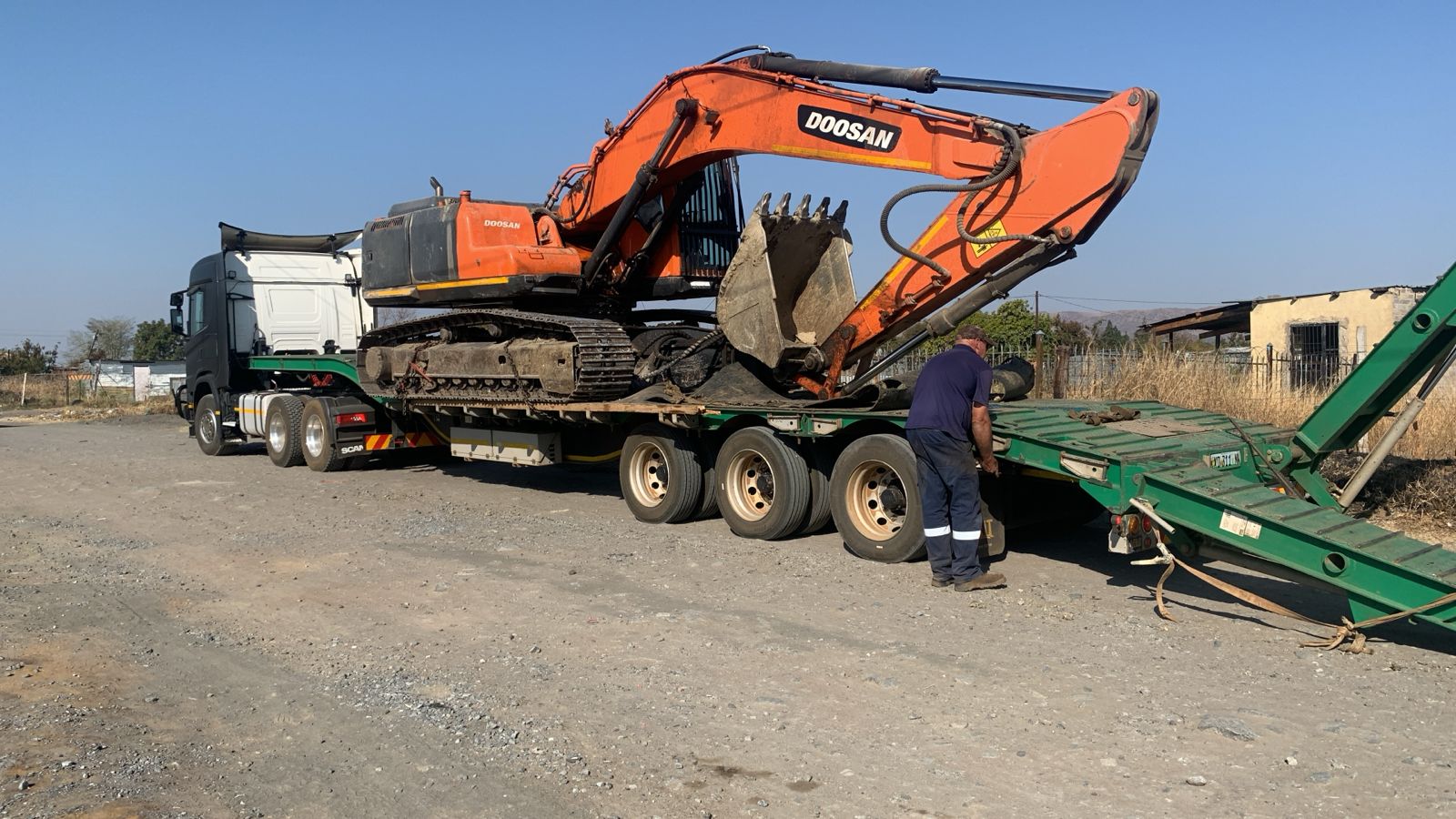 Excavator on lowbed trailer